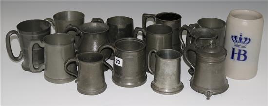 A collection of thirteen assorted pewter mugs and tankards and a stoneware stein